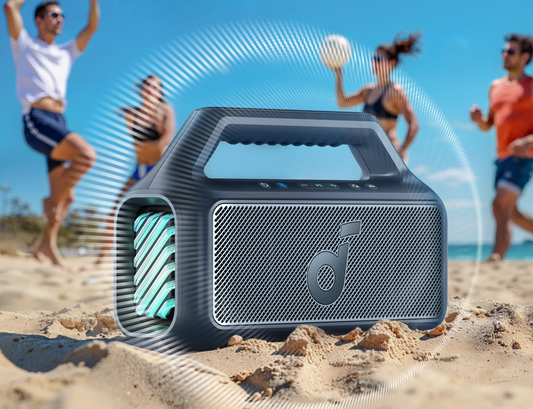 soundcore Boom 2 bluetooth speaker is being used on the beach.