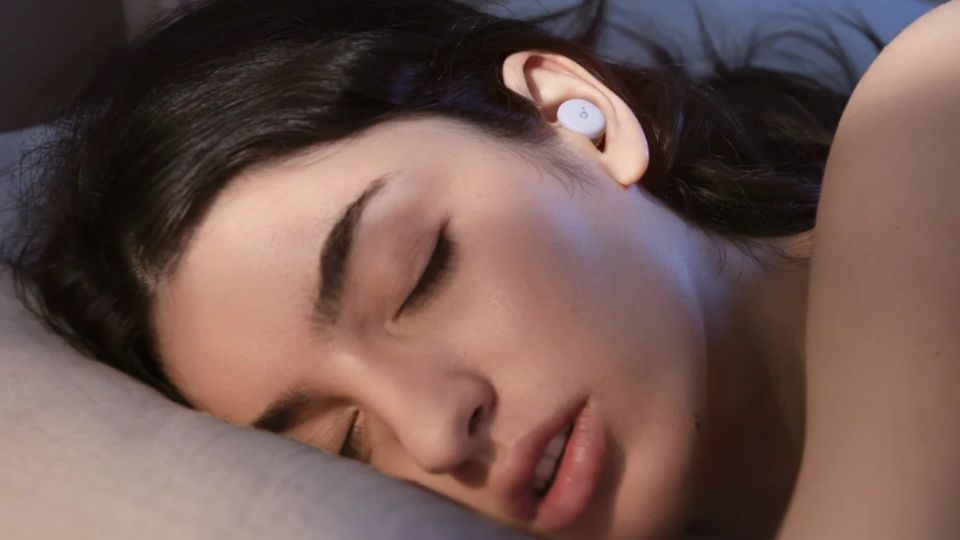 Women sleeping with earbuds