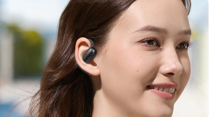 Woman wearing soundcore open-ear headphone